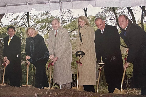 A group holding shovels at the groundbreaking ceremony