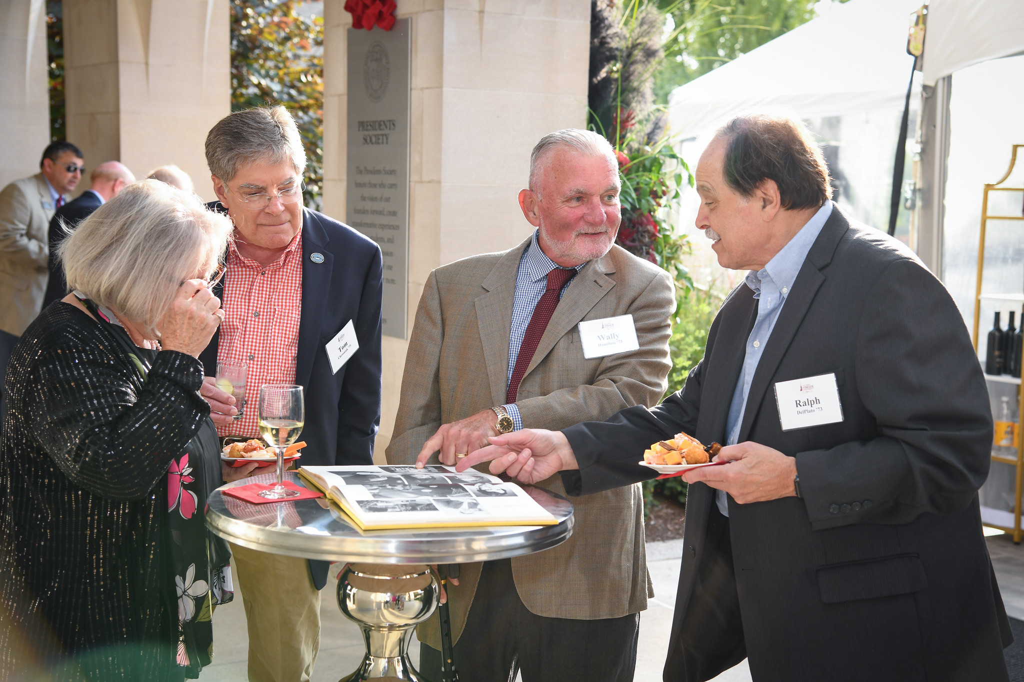 Alumni celebrating their 50th reunion reminisce together