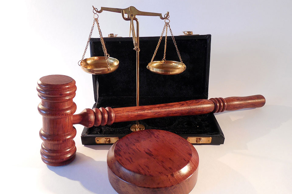 A gavel and justice scales.