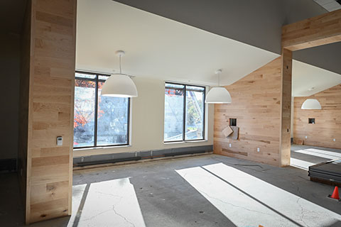 Light fixtures and light wood walls provide a preview of the interior of Lavery Library.