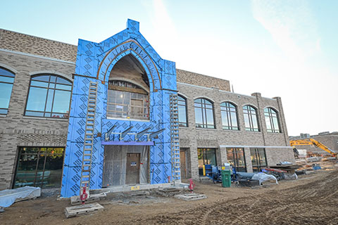 The exterior entrance of Lavery Library boasts the signature Fisher brick and archways.