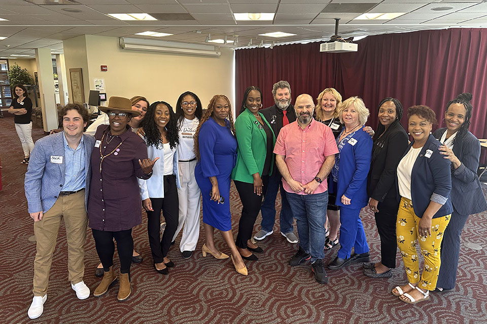 Students in the Ed.D. Program gather for a photo after their poster presentation session.