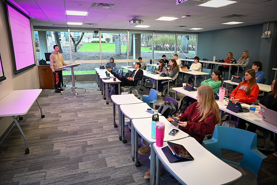 Students interact in a classroom.