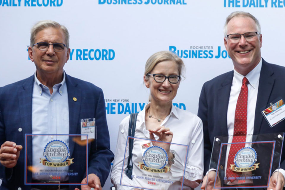 Provost Kevin Railey, Kristin Lennarz, and Dean Dan Connolly at the RBJ Reader Rankings celebration.