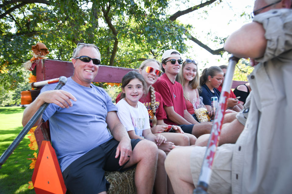Fisher families enjoy a hayride during Family Weekend.