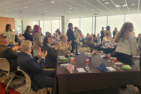 Members of the Teddi Dance for Love committee stand to be recognized at the Very Beary Brunch.