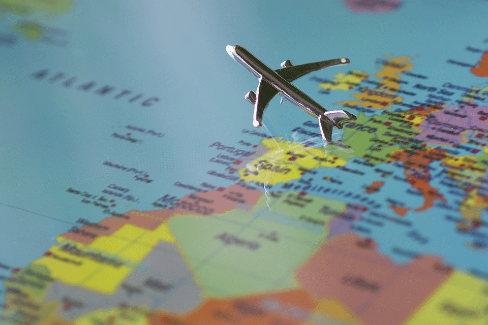 A toy plane over a map.