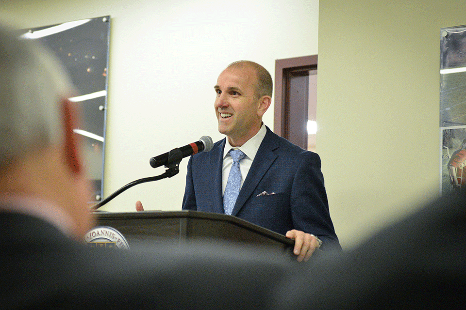 University Trustee Matt Rowe ’90 offers remarks during the dedication of the football coaching suite in honor of his father, William E. Rowe ’61.