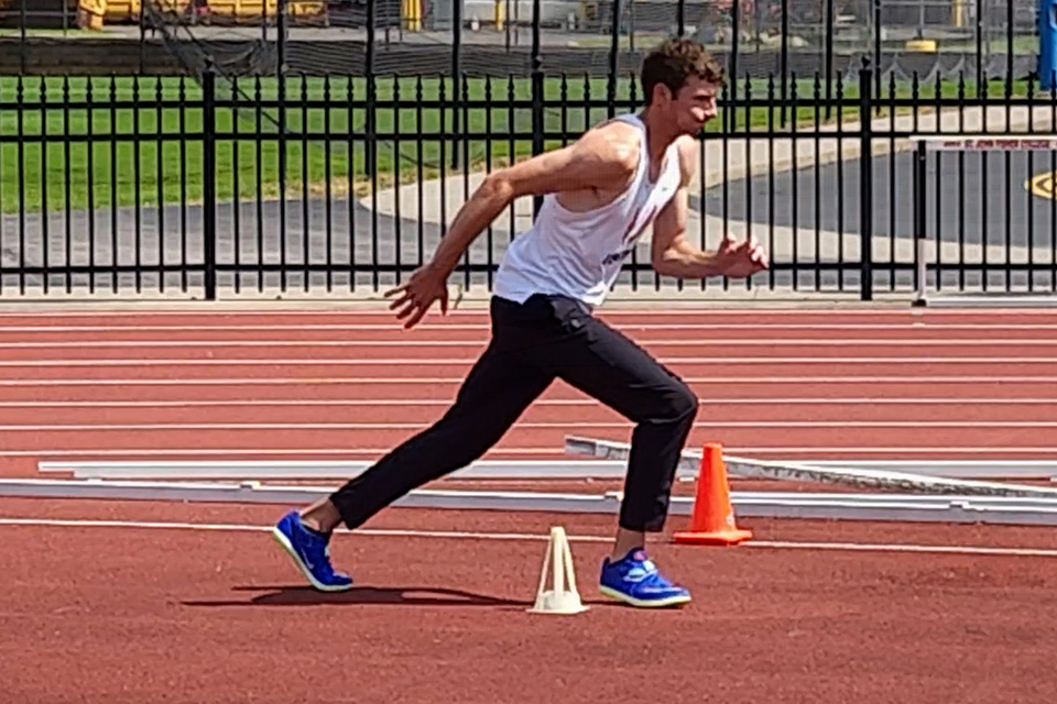 Alumnus Kyle Rollins practices at the Polisseni Track and Field Complex