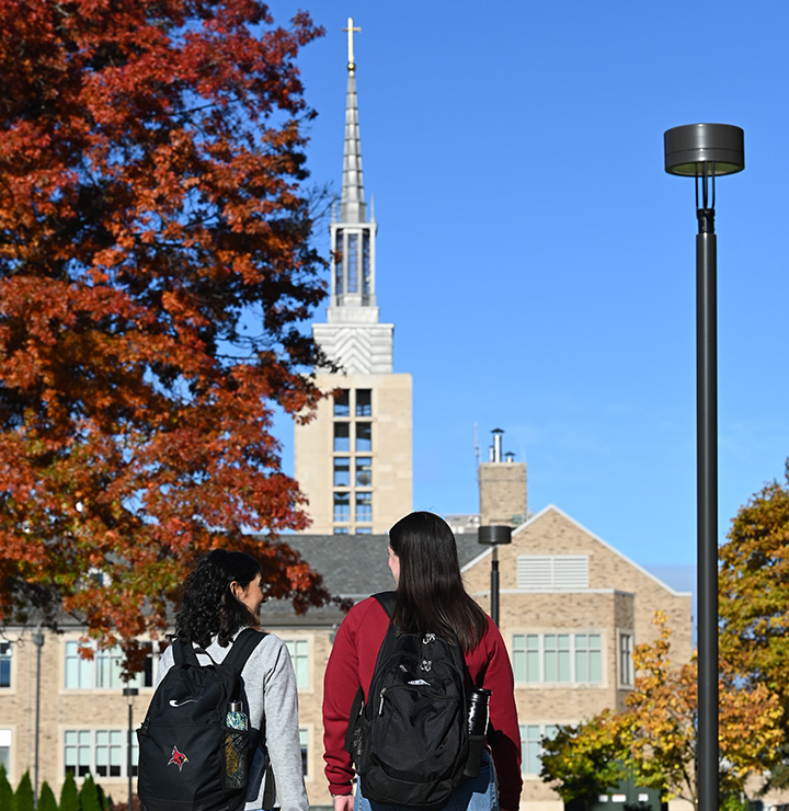 Students walking toward Kearney Hall, Fisher’s iconic first building.