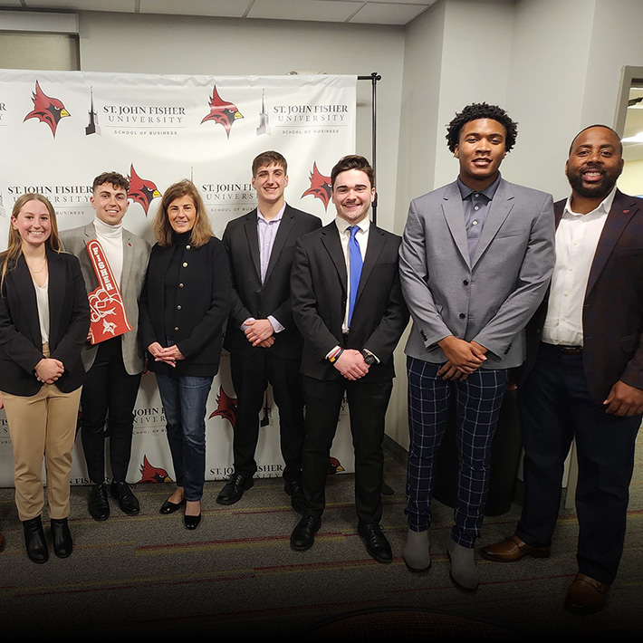 Business students stand together to celebrate the Inaugural Fish Tank Competition.