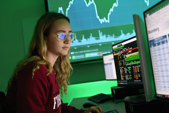 A student works at a Bloomberg terminal in the Parkes Trading Lab.