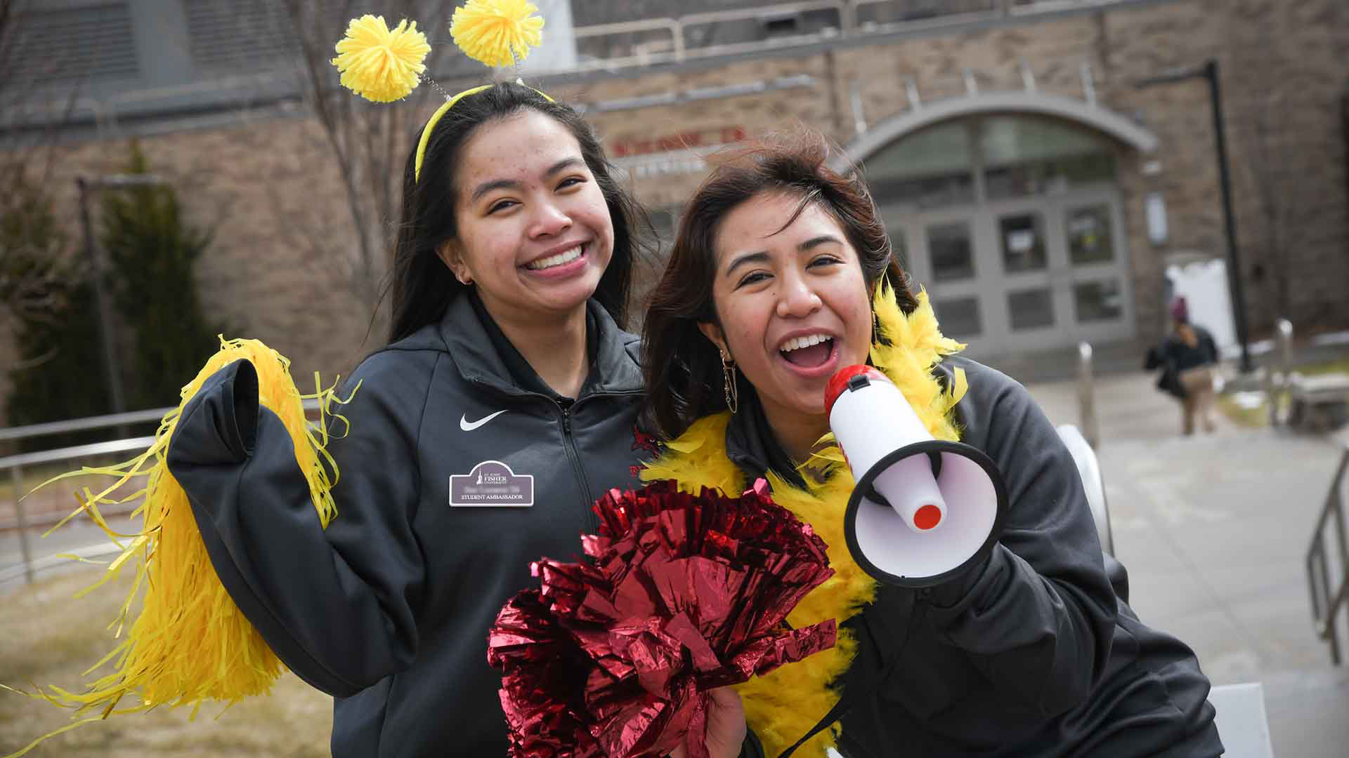 Students in front of Athletic Center welcoming new students to campus.