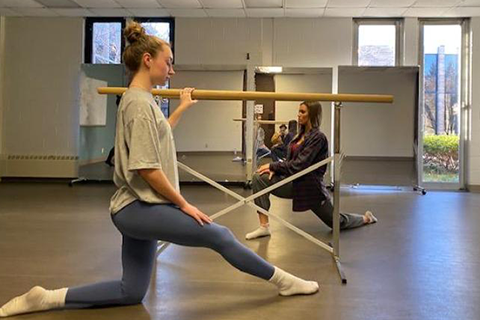 Students stretching in the dance studio